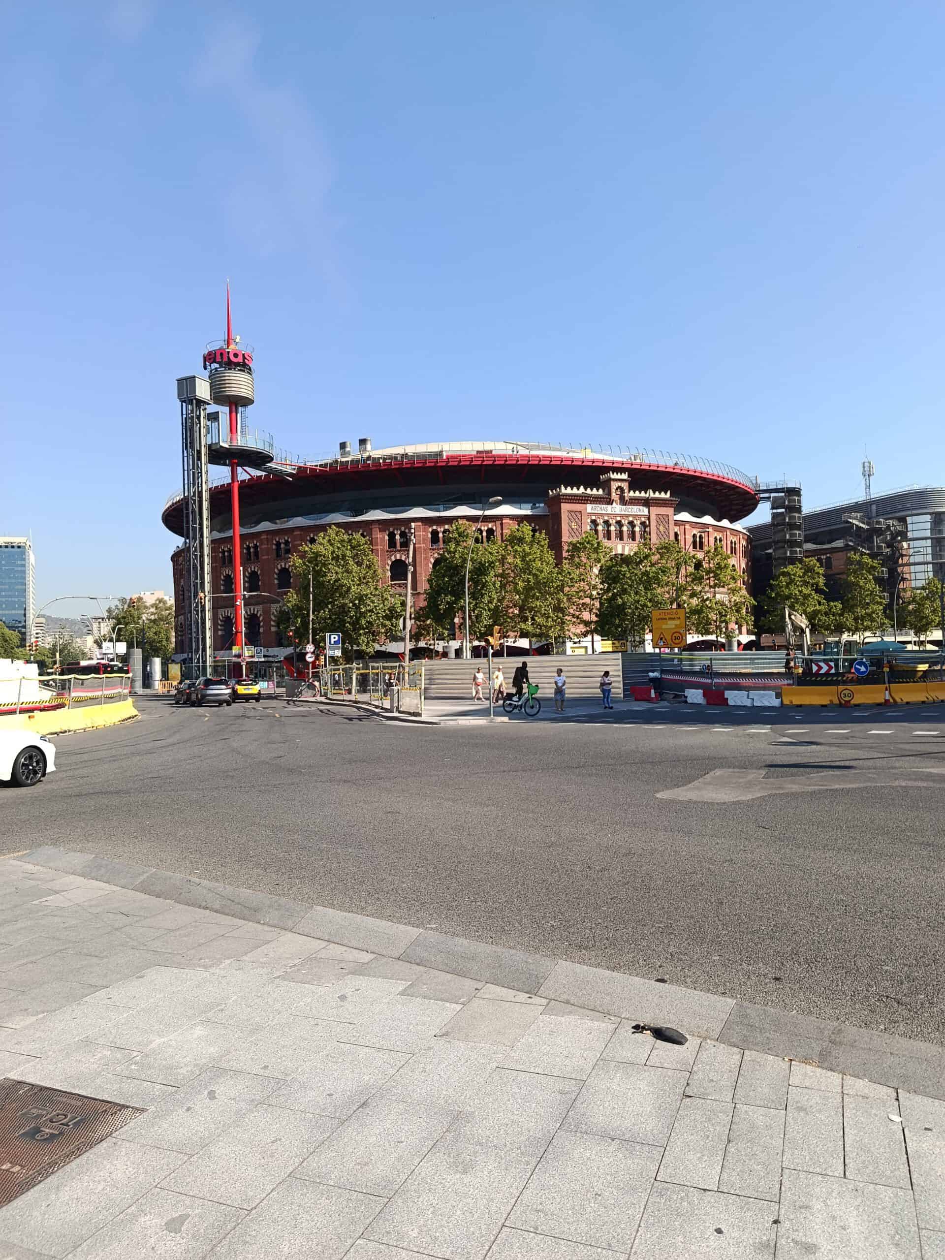 City center with a modern circular building and a tall observation tower.