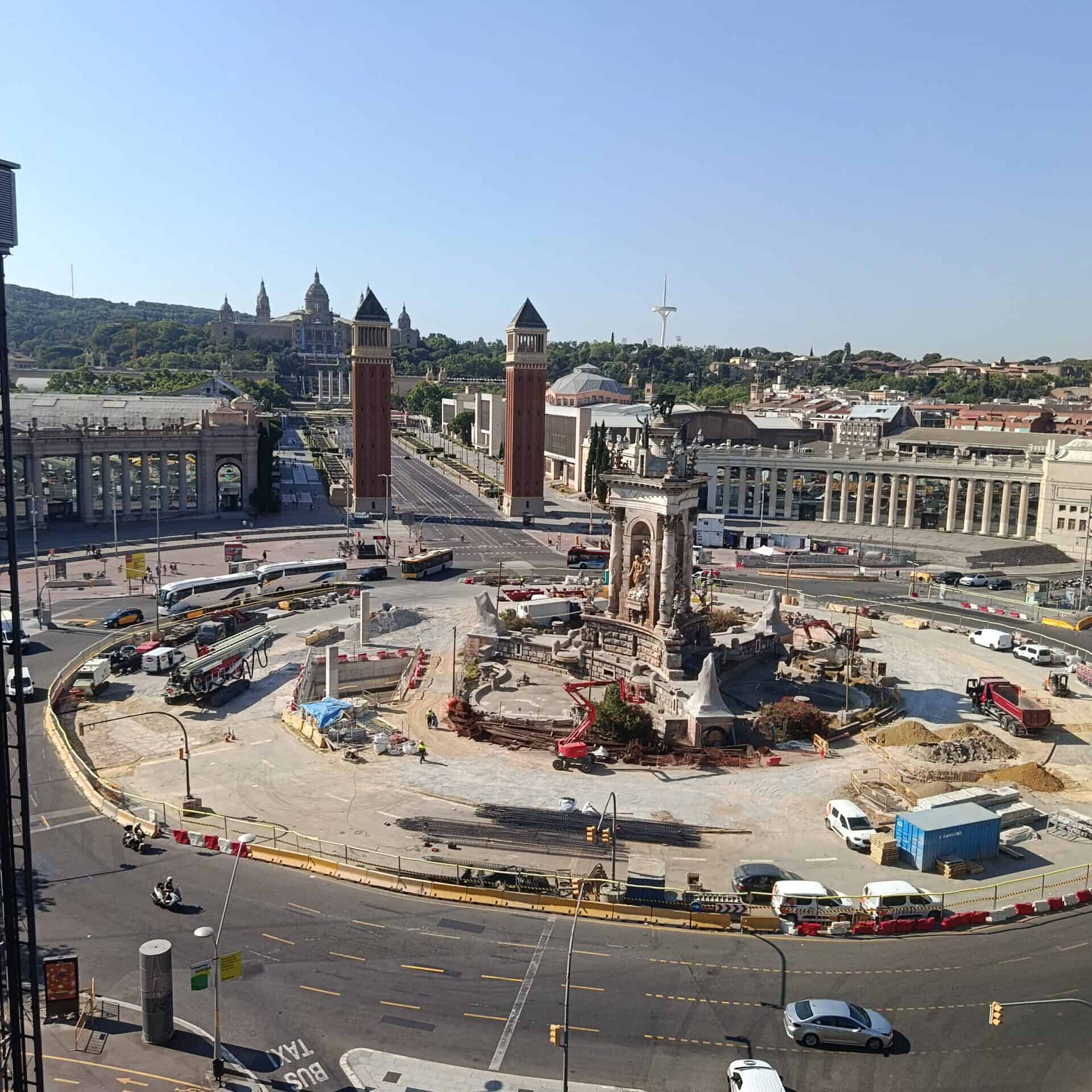 City square with ongoing construction and historic buildings in the background.